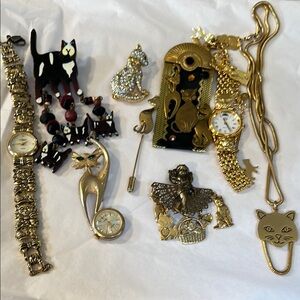 Kirks Folly Gold-tone Cat watch, 6 Cat Brooches and Car Eye Glass Holder.